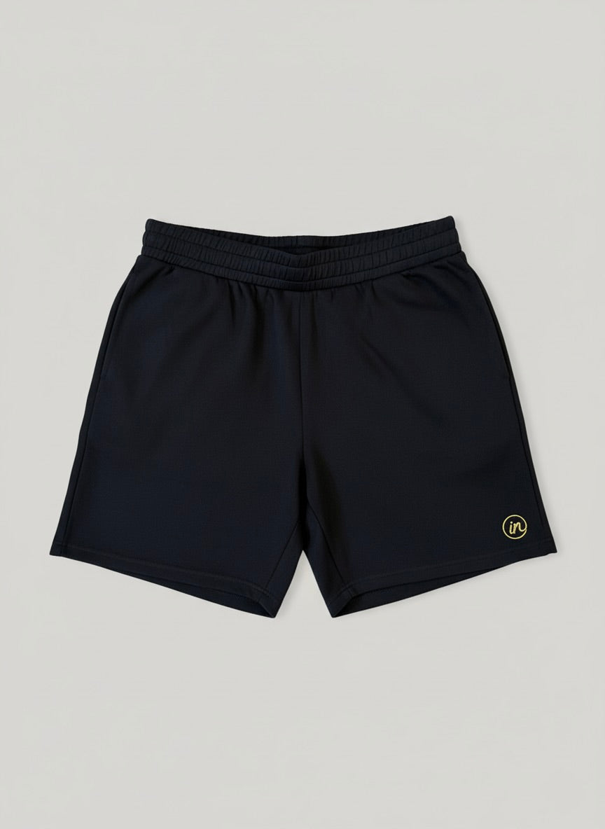 Inherit Noir DuraLuxe 7" Performance Shorts in Black. Lifestyle view.