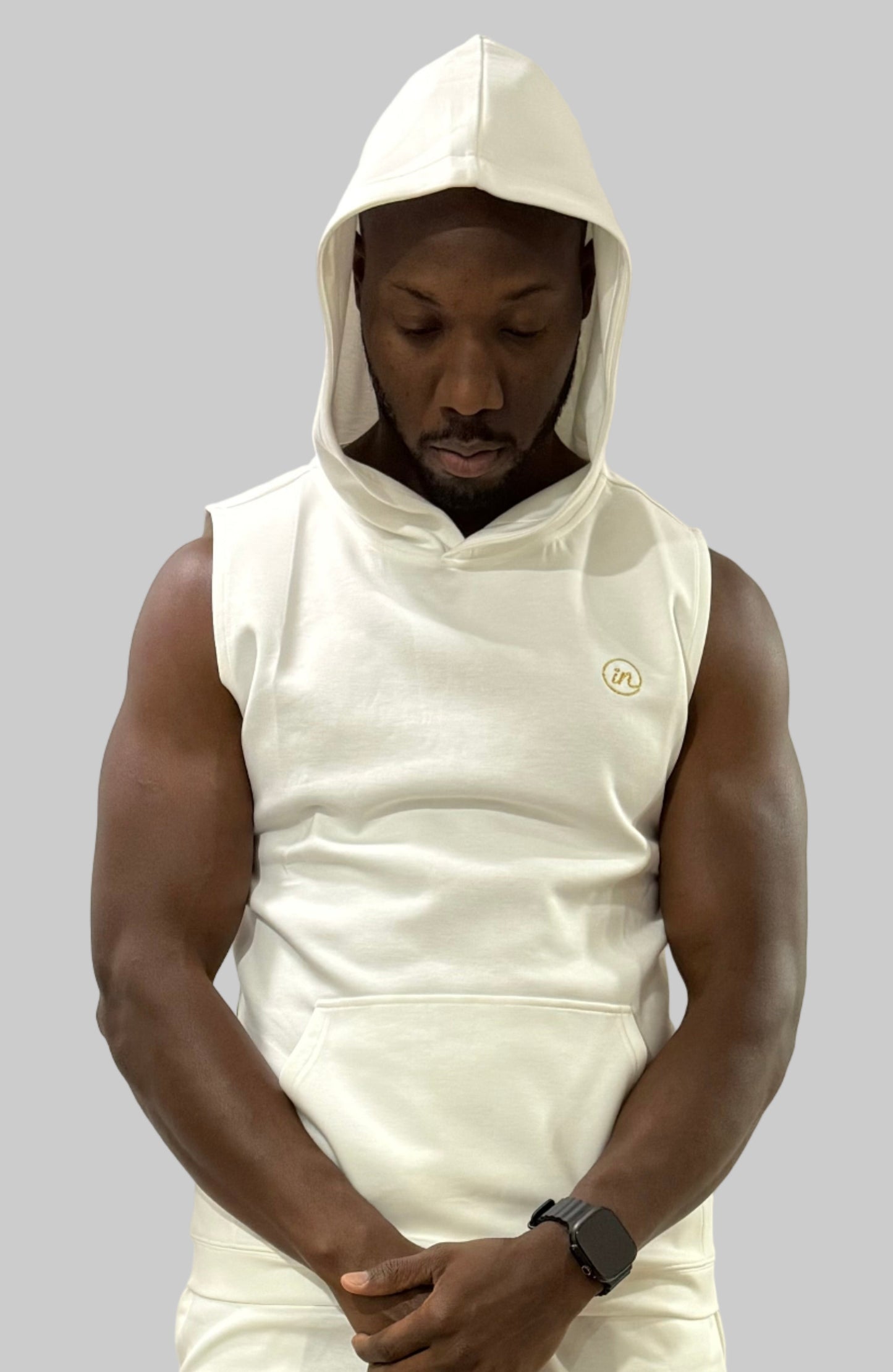 Inherit Noir IN Sleeveless Hoodie in Off White. Flat-lay product detail.