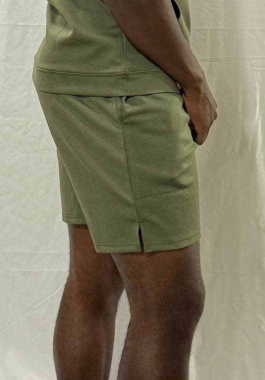 Inherit Noir DuraLuxe 7" Performance Shorts in Olive. Flat-lay product detail.