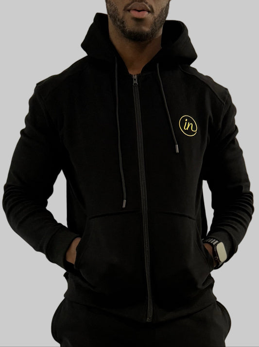 Inherit Noir Full Zip Hoodie in Black. Flat-lay product detail.