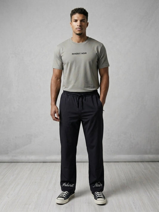 Inherit Noir Relaxed Fit Signature Joggers in Black. Flat-lay product detail.
