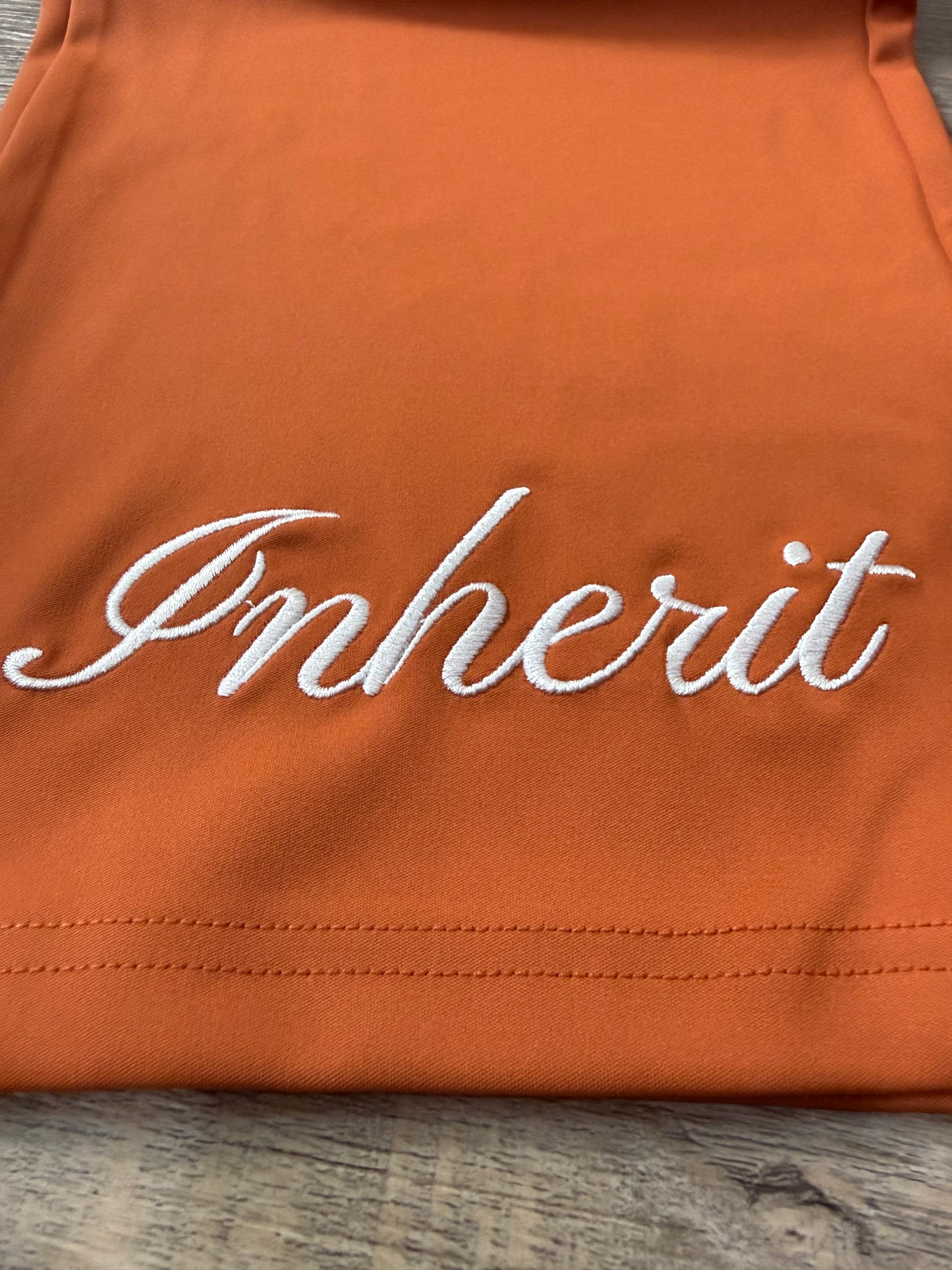 Inherit Noir Relaxed Fit Signature Joggers in Orange. Flat-lay product detail.
