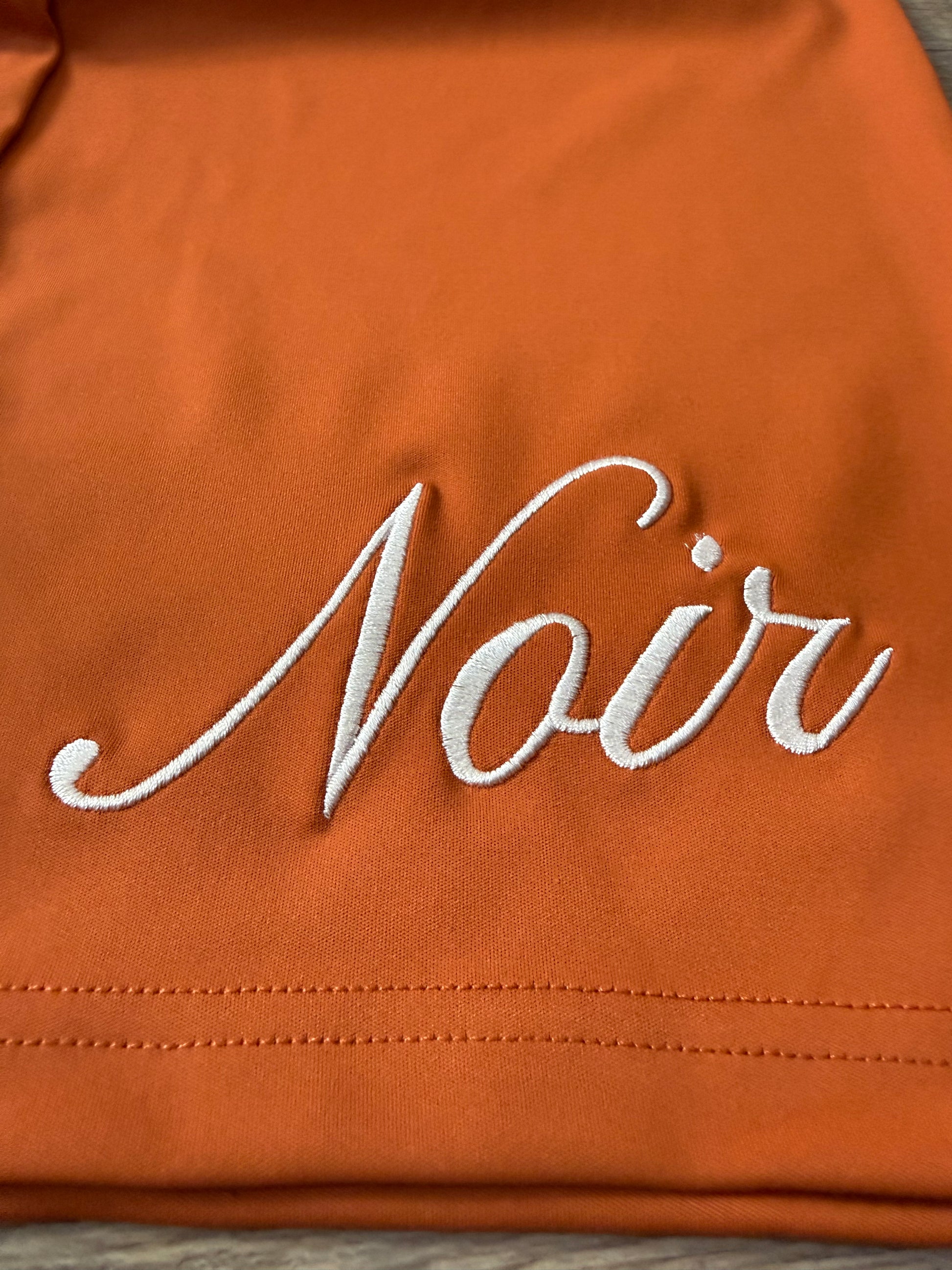 Inherit Noir Relaxed Fit Signature Joggers in Orange. Flat-lay product detail.