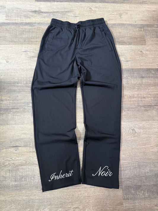 Inherit Noir Relaxed Fit Signature Joggers in Black. Flat-lay product detail.