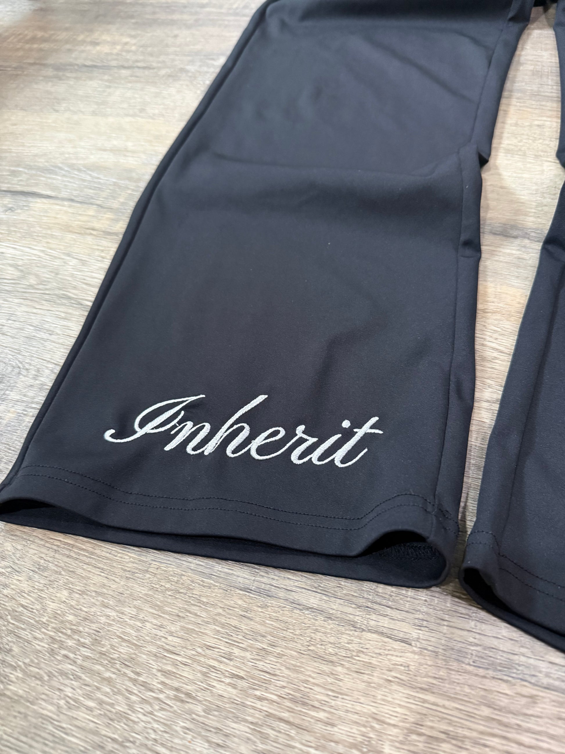 Inherit Noir Relaxed Fit Signature Joggers in Black. Flat-lay product detail.