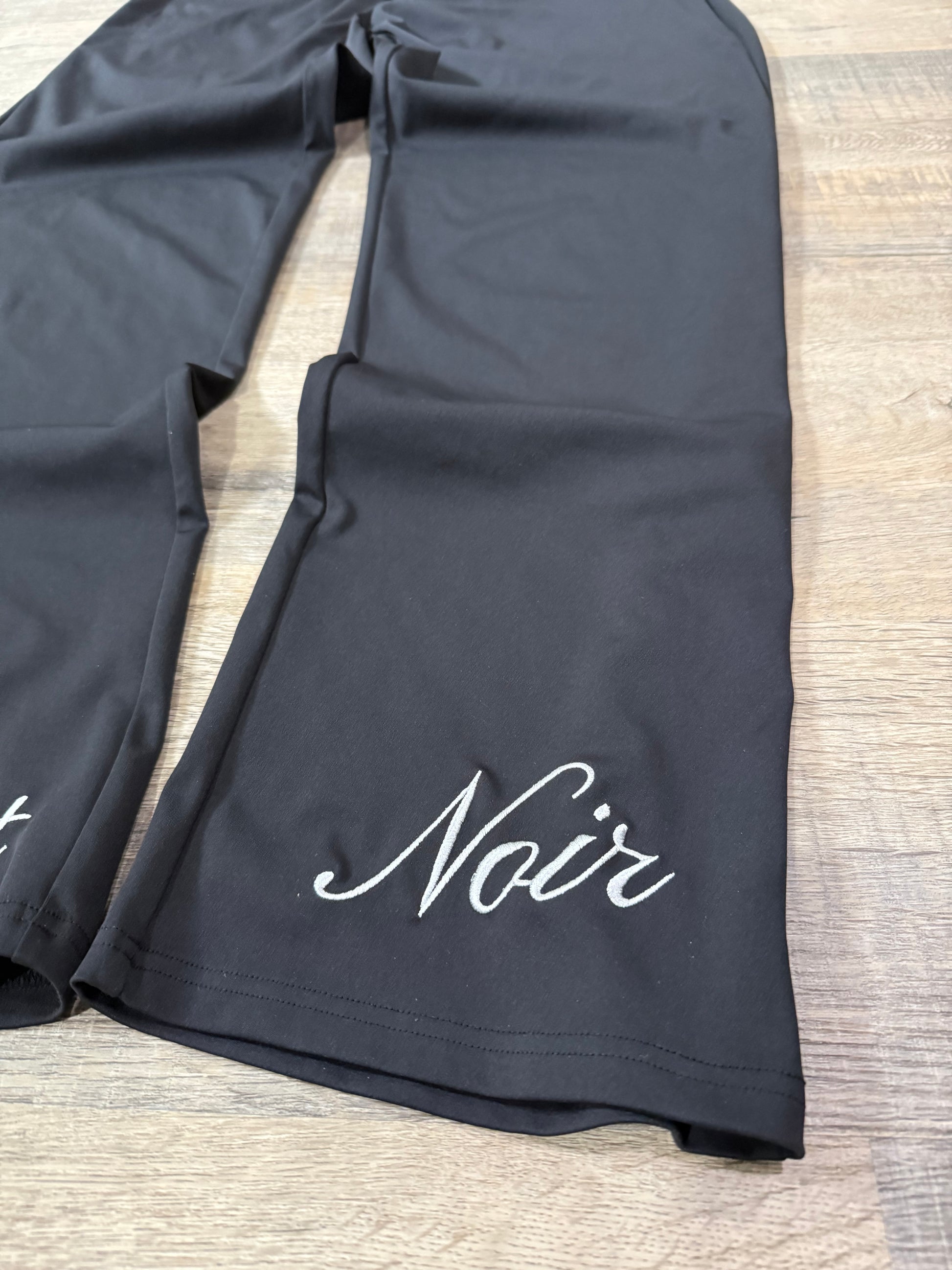 Inherit Noir Relaxed Fit Signature Joggers in Black. Flat-lay product detail.