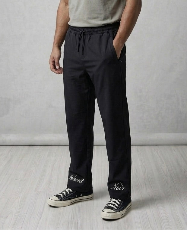 Inherit Noir Relaxed Fit Signature Joggers in Black. Flat-lay product detail.