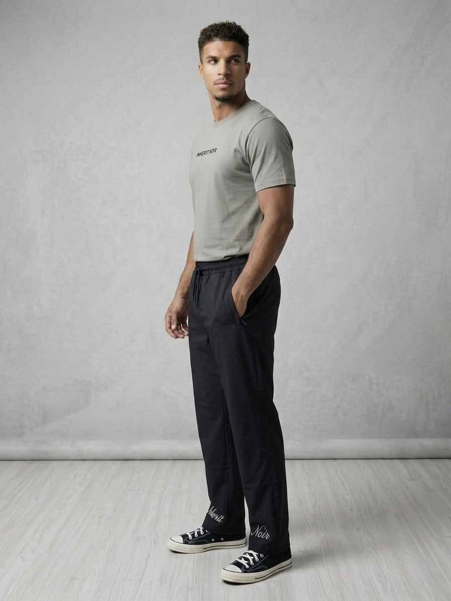 Inherit Noir Relaxed Fit Signature Joggers in Black. Flat-lay product detail.
