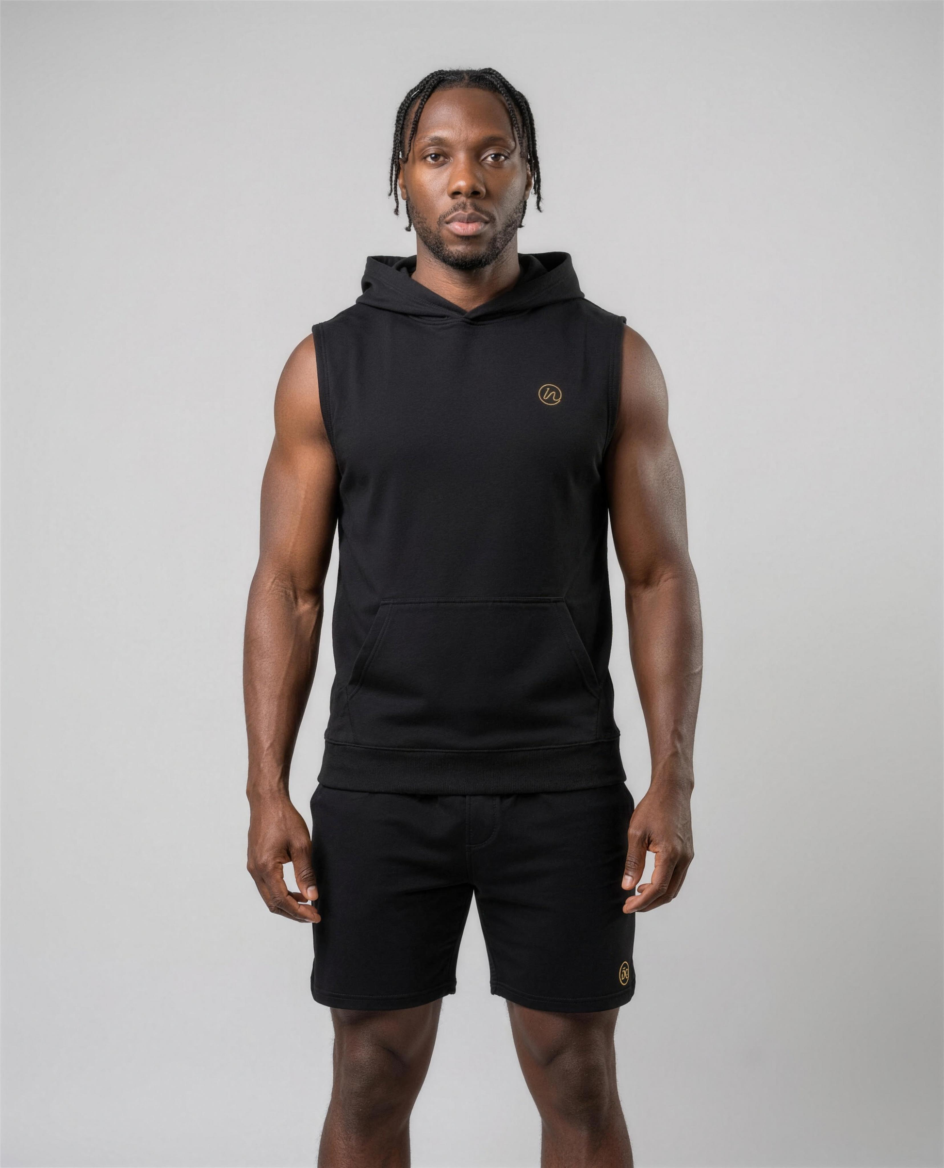 IN Sleeveless Hoodie Black — studio front on-model