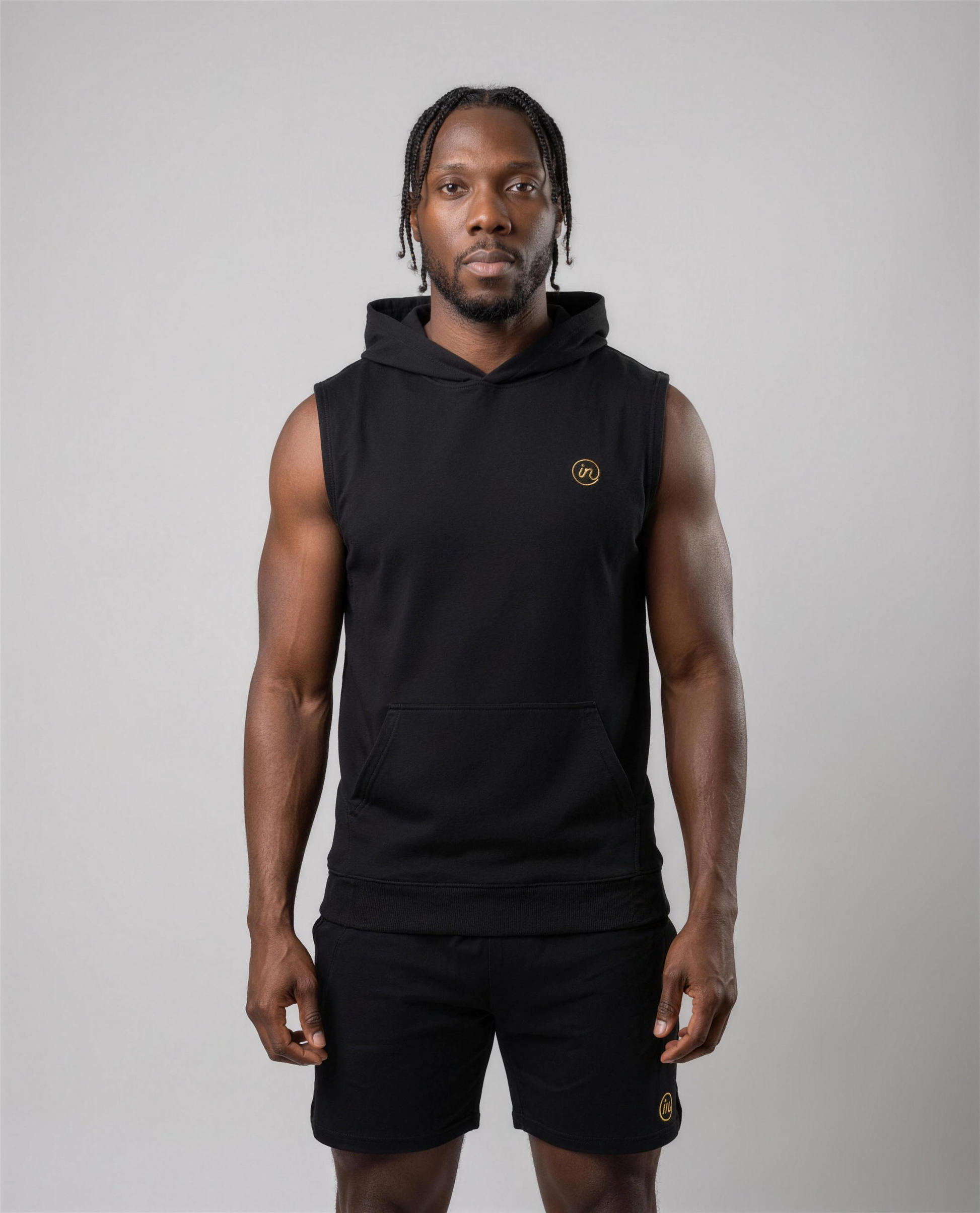 IN Sleeveless Hoodie Black — studio full length on-model
