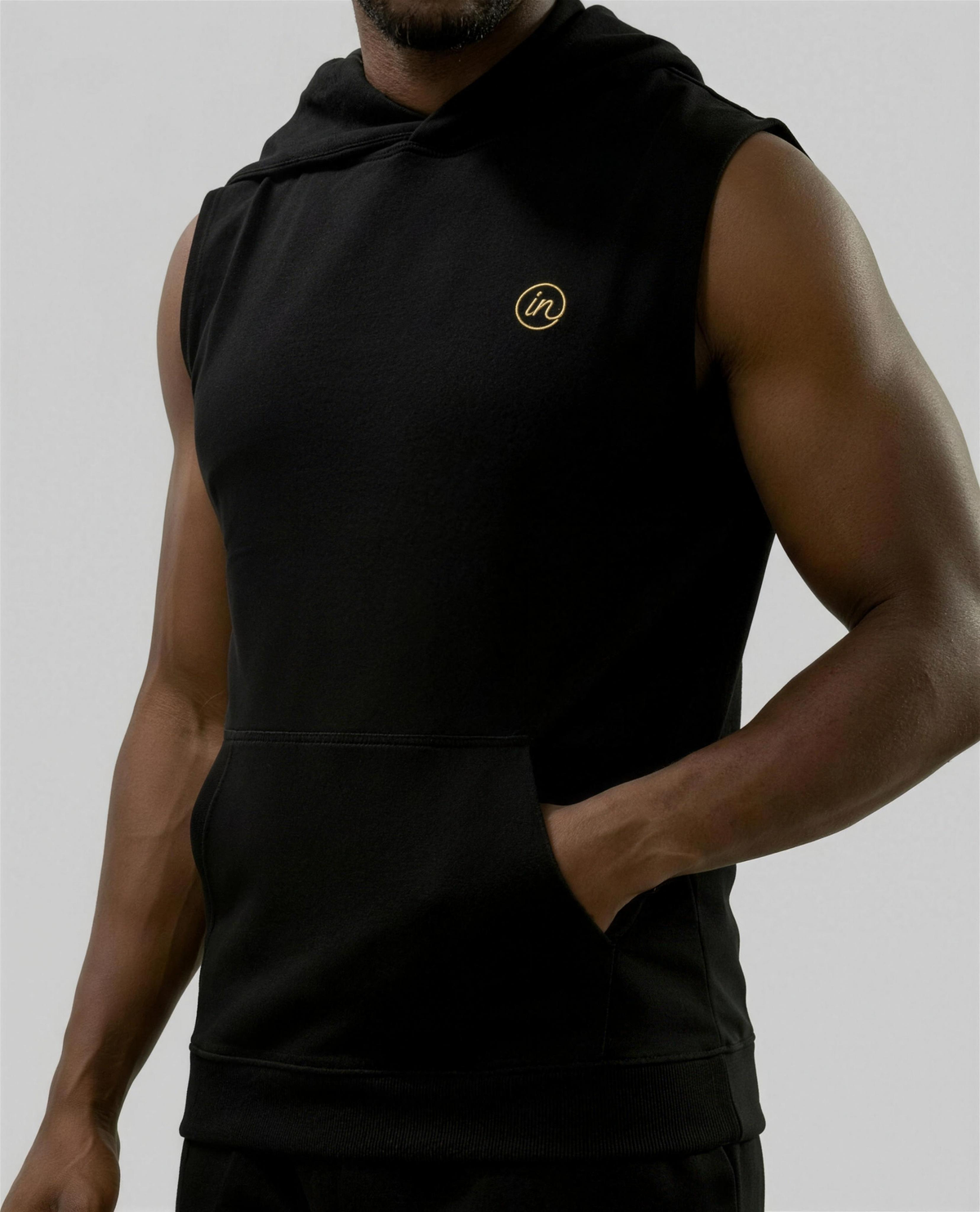 IN Sleeveless Hoodie Black — studio fit detail on-model